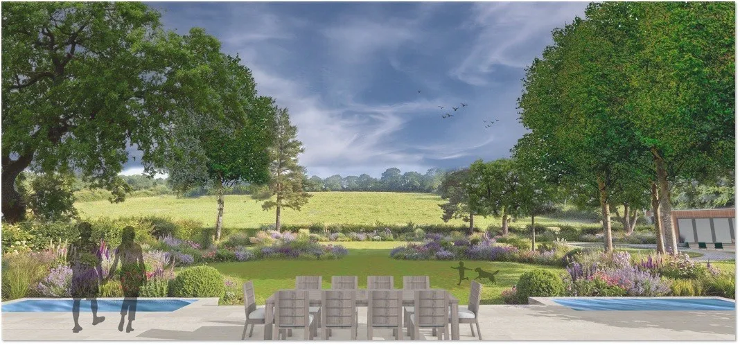 A dining terrace with a long lawn framed by mixed borders, looking out to open countryside