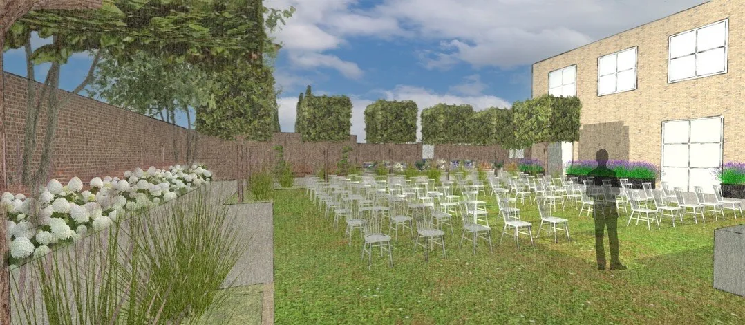 A lawn set out with rows of chairs for an outdoor ceremony