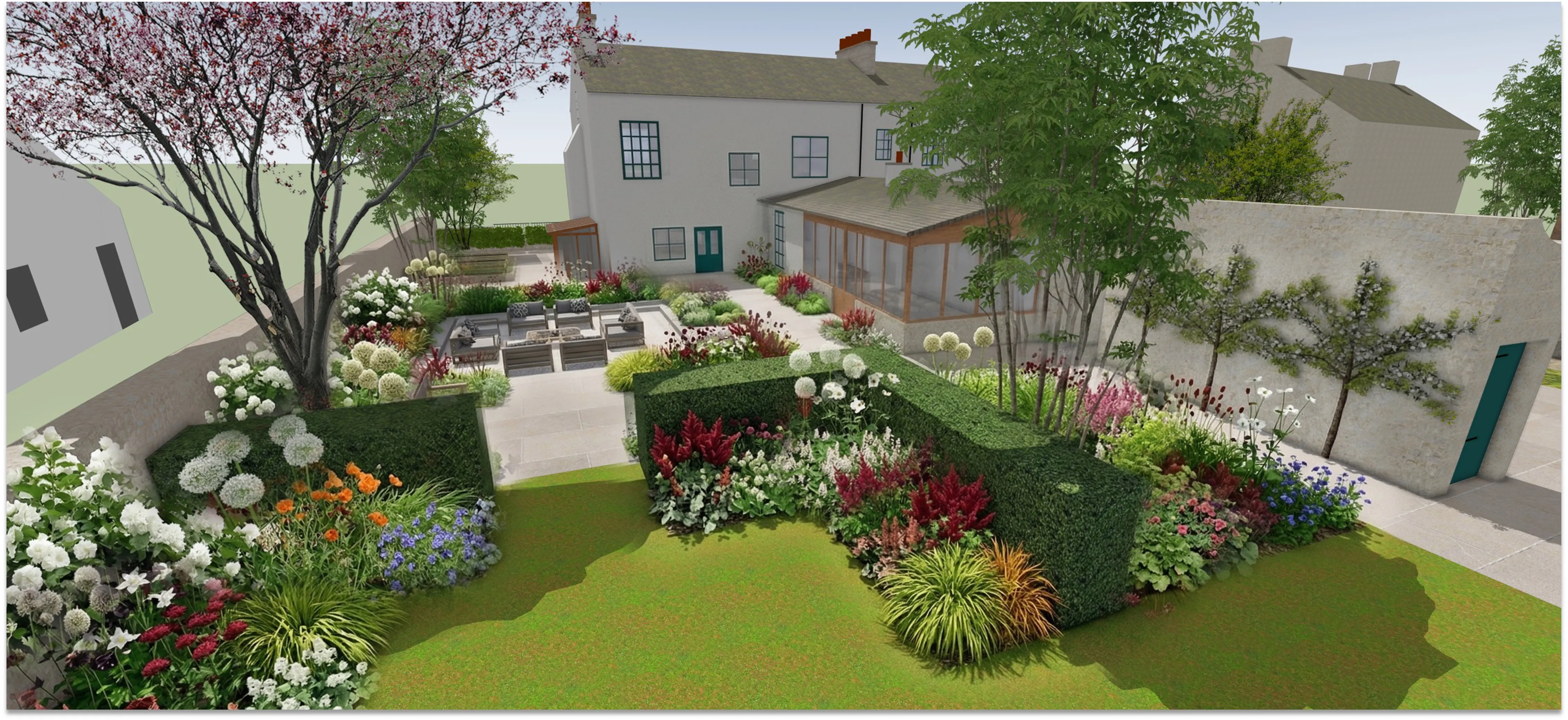 A lawn framed by sculpted hedges and colourful herbaceous borders behind the house